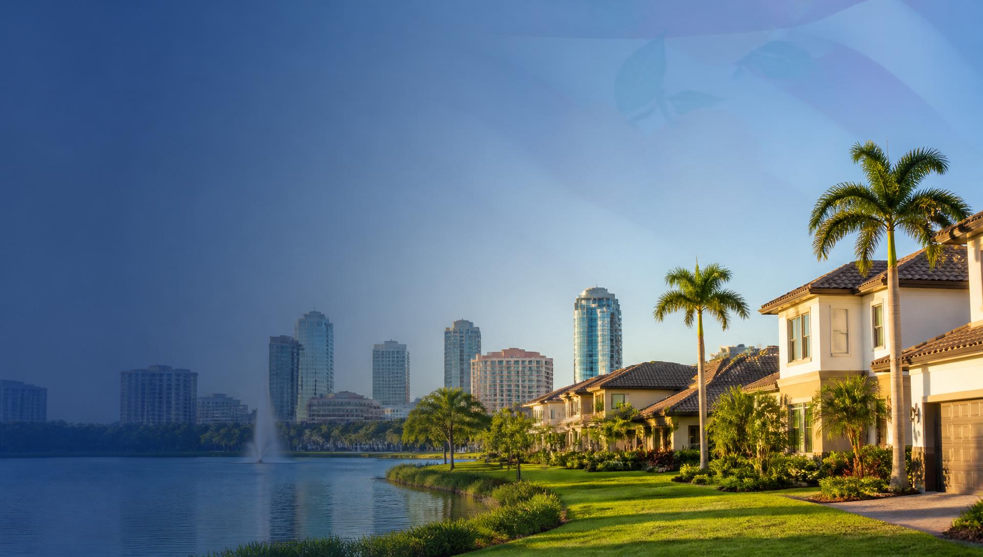 Aerial golden-hour view of a fast-growing Orlando-area suburban community with terracotta-roof homes, palm-lined streets, small lakes and the Orlando skyline in the distance — 2026 Florida investment market.